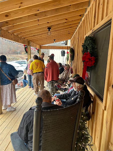 Folks catching up on the latest news on the front porch of Peterson's store. 